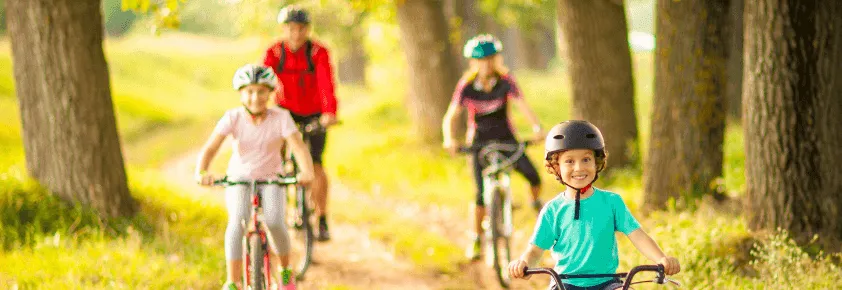Photo of a family cycling in the countryside