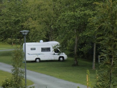 CAMPING-CAR PACKAGE (pitch with camper van, without electricity (+optional), 2 people included)