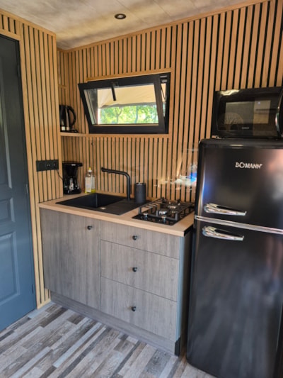 Glamping wooden hut under Saharan canvas