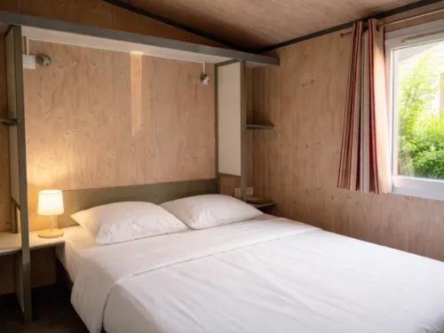 Accommodation - Fisherman's Hut - 30M² - 2 Bedrooms - image n°4 - Camping Oasis des Dombes