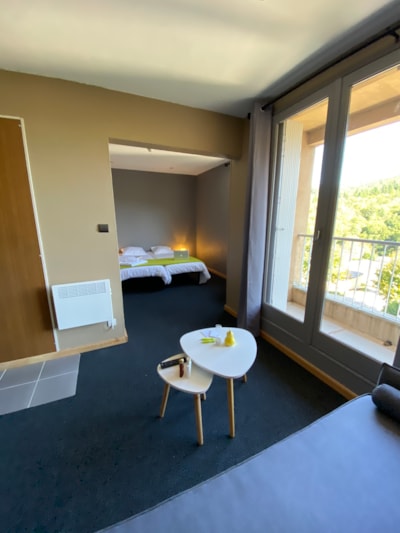 Hotel room for 1 to 4 people, linen kit provided, beds not made, towel provided