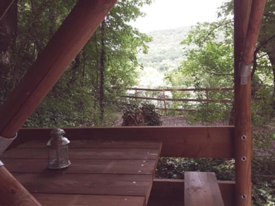 Bivouac hut on stilts under the trees