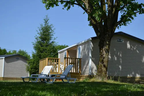 Location - Mobil-Home Premium 35M² 2 Chambres + Terrasse Semi-Couverte + Tv + Lv + Clim - image n°1 - Flower Camping Les Plages de l'Ain