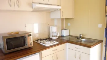 Mietunterkunft - Mobilheim Modulo 20M² / 1 Zimmer + Überdachte Terrasse 12M² - Le Clos du Moulin