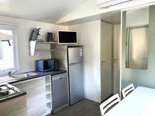 Location - Les Conforts - Mobilehome 4 Personnes 2 Chambres Dim/Dim * - image n°3 - Camping Paradis Family des Issoux