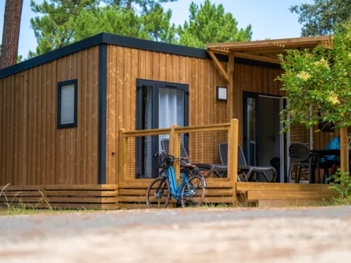 Accommodation - Homeflower Premium 29M² - 2 Bedrooms + Half-Covered Terrace + Tv + Air Co + Sheets Included - image n°1 - Flower Camping Les Iles 