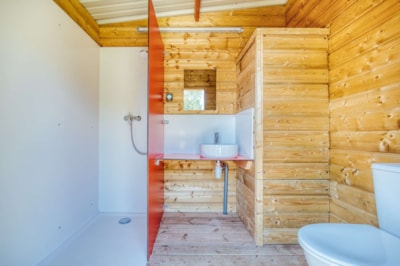 Premium pitch with private sanitary facilities and kitchenette!