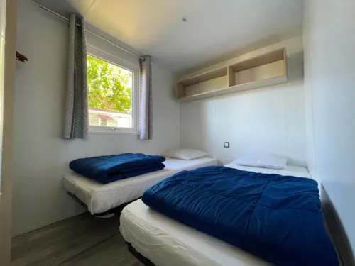 Mietunterkunft - Mobilheim Rapidhome 2018 Alizé 2 Zimmer - Halbüberdachte Terrasse - Mit Klimaanlage - image n°7 - International Camping