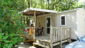 Locatif - Mobile-home Domino STANDARD 24m² - 2 bedrooms + TV + Half-covered terrace 10m² - Flower Camping LES TRUFFIERES