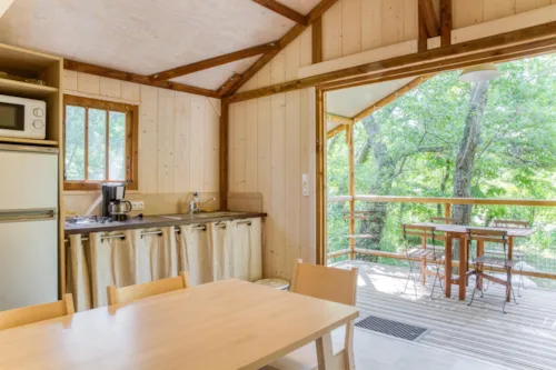 Location - Cabane Lodge Bois Sur Pilotis Confort 27M² 2 Chambres - Terrasse Bois Couverte, Zone Ombragée - image n°5 - Flower Camping Les Rives de l'Aygues