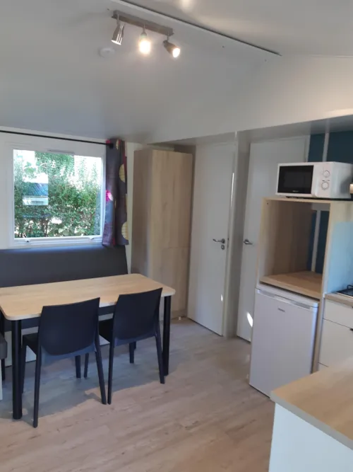 Huuraccommodatie(s) - Stacaravan Tournette 27M² - Half-Schaduwrijk Terras Tv - image n°7 - Camping Le Panoramic