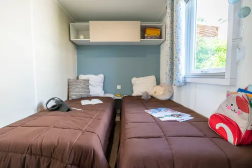 Location - Confort Climatisé 22 M² / 2 Chambres - Terrasse Couverte 9M² - image n°6 - CAMPING LES BASTETS