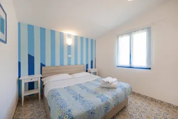 Mietunterkunft - Bungalow Superior (Klimaanlage, Tv, Föhn) - Holiday Village & Camping Nettuno