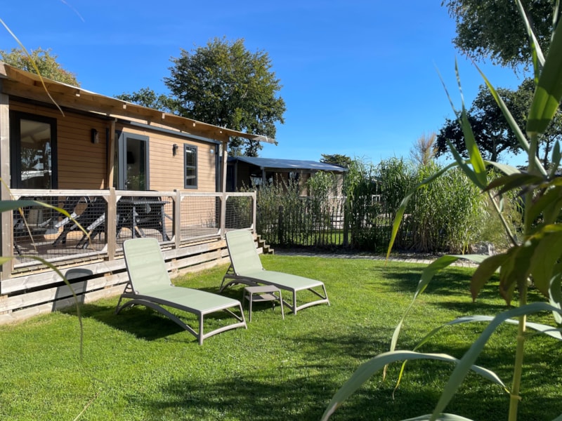 Mobilheim HORIZON Premium 33m² 3 Schlafzimmer / überdachte Terrasse + TV + bettbezug / Fußgängerzone