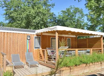 Mietunterkunft - Mobilheim Holz Premium 33 M² (3 Schlafzimmer – 6 Personen) + Tv + Halbüberdachte Terrasse + Bettwäsc - Flower Camping La Canadienne