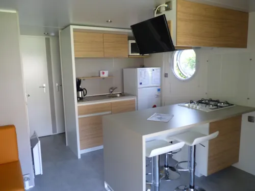Location - Mobil Home Premium 32 M² 2 Chambres + Terrasse 12M² Semi-Couverte (9M²) + Tv + Climatisation - image n°5 - Flower Camping Le Riviera