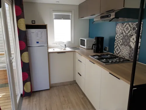 Location - Mobil Home Premium 32 M² 2 Chambres + Terrasse 12M² Semi-Couverte (9M²) + Tv + Climatisation - image n°4 - Flower Camping Le Riviera
