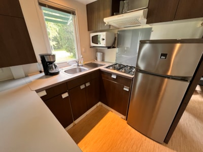 Mobile-home Confort 38m² 3 bedrooms + TV + sheltered terrace 18m² + 2 bathrooms