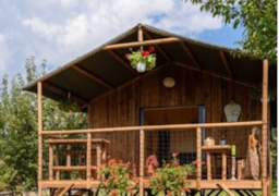 Mietunterkunft - Cottage Premium (2022) Am Flussufer, 2 Schlafzimmer, Überdachte Terrasse 5 Pers. - Camping Brantôme Peyrelevade