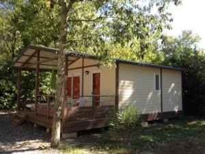 Locatif - Chalet CONFORT VAIA 27m² 2 bedrooms - sheltered terrace + air-conditioner - Flower Camping Le Plan d'Eau - Ardèche