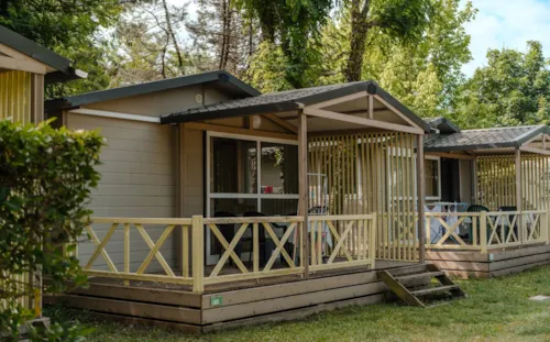 Location - Chalet -  2 Chambres - 32 M² - Terrasse - Tv. - image n°2 - Camping du Pont