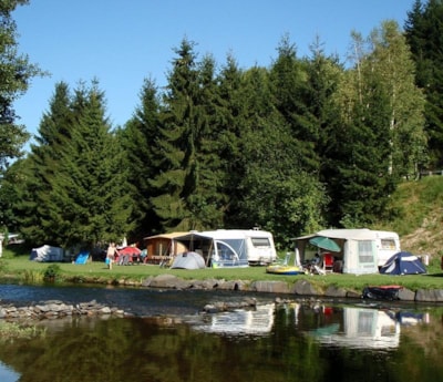 Pitch at the riverbank + Camper or Car and caravan + Electricity