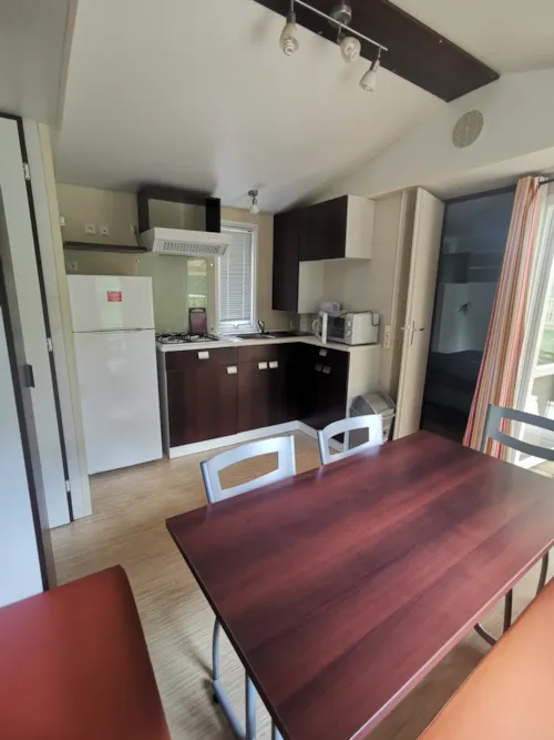 Huuraccommodatie(s) - Hirondelle - Clim + Tv Stacaravan  28 M² + Tv - image n°2 - Ushuaïa Villages - Camping Les Pins d'Ucel ****