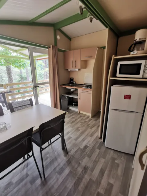 Huuraccommodatie(s) - Genet - Clim + Tv Chalet 21.5M² + Tv - image n°4 - Ushuaïa Villages - Camping Les Pins d'Ucel ****