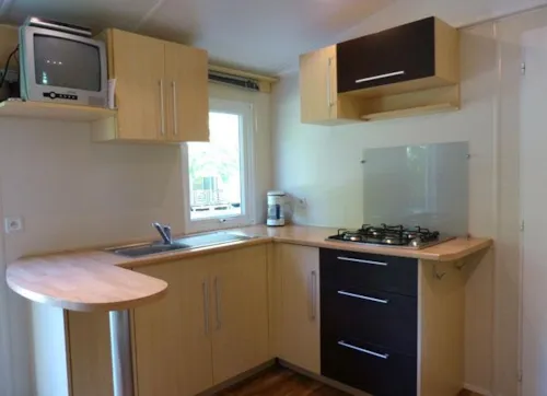Location - Mobil Home 2 Chambres - image n°2 - Camping Les Acacias