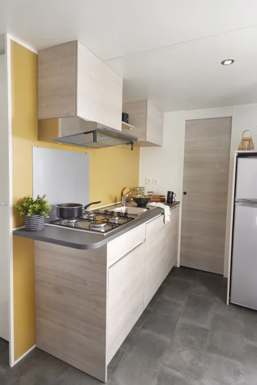 Location - Mobil Home Ib Trigano Evo 29 2 Chambres Clim Et Télévision - image n°3 - Camping Le Sous-Bois Ardèche