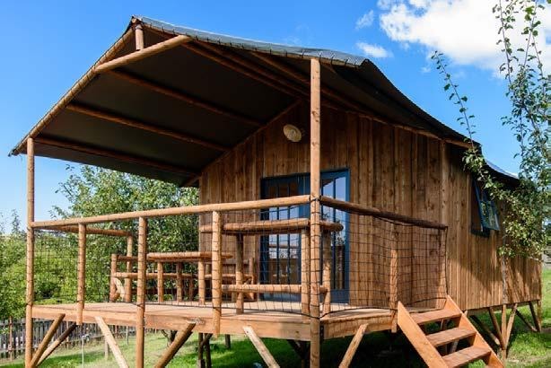 Wooden cabin on piles L'Encantada