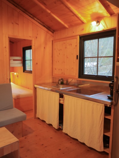 Wooden cabin on stilts “L'Encantada”