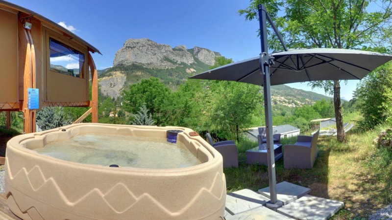 Zeltbungalow Nature Luxe 32m² - 4 Erw + 1 Kind - Jacuzzi