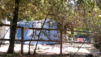 Pitch (middle tent/big tent) + car in the parking. Terraced campsite. — 2