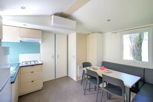 Accommodation - Mobile Home Confort 29M² 3 Bedrooms With Covered Terrace + Air Conditionning + Tv - image n°3 - Camping Le Château