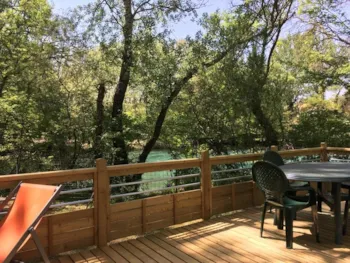 Mietunterkunft - 'Patio' Fluß Cottage - 33M2 - 2 Zimmer + 2 Badezimmer + Klimaanlage - Camping La Coutelière