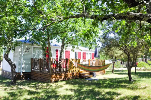 Mietunterkunft - Cottage "Laurier" - 3 Schlafzimmer - Reihe Confort - image n°6 - Camping L'Ombrage