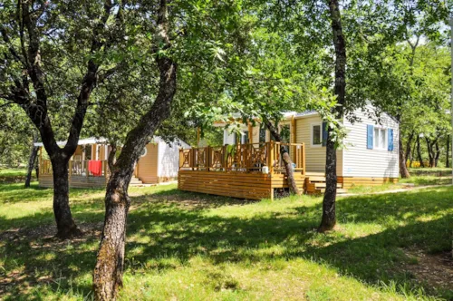 Mietunterkunft - Cottage "Laurier" - 2 Schlafzimmer - Reihe Confort - image n°4 - Camping L'Ombrage