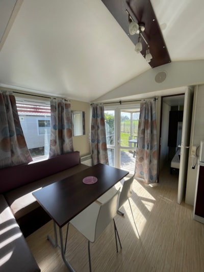 Mobile-home 26m² + integrated semi-covered wooden terrace of 7m². — 3