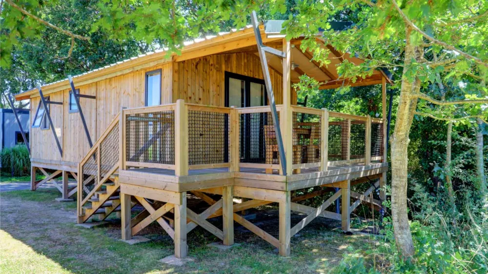 Location - Cabane Lodge Sur Pilotis - 2 Chambres : 32 M² + Terrasse 11 M² Couverte - Airotel Camping La Roseraie