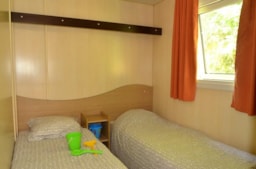 Mietunterkunft - Cottage 3 Zimmer Klimaanlage 28M² - Camping Les Terrasses du Lac