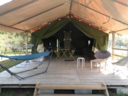 Accommodation - Tent Freeflower Without Toilet Blocks + Terrace Côté Étang -  Camping Les Étangs Mina