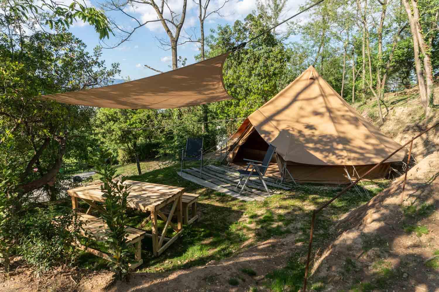 Accommodation - Wild, Bell Tent, Circular, With Double Bed, Two Single Beds, Rustic Outdoor Table, Four Chairs And A Hammock - Camping Barco Reale