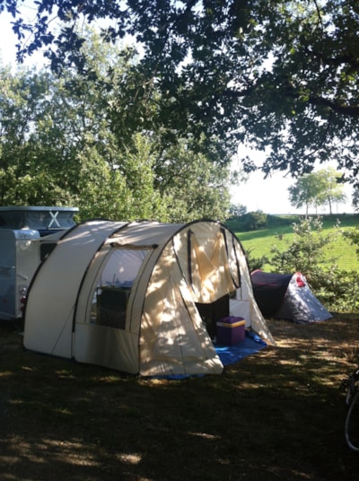 Camping Plot:  80m². 1 or 2 people + tent or caravan or Campervan + 1 car + 6 amp